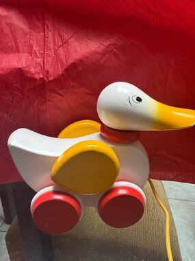 Classic White & Yellow Pull-Along Duck Toy with Red Wheels